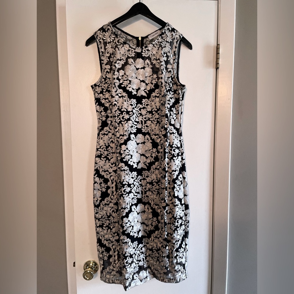 Calvin Klein White lace over black slip dress.